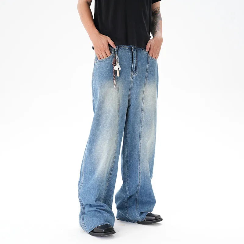 Light blue vintage wash wide leg denim jeans on a model, showing the relaxed fit and zip fly.