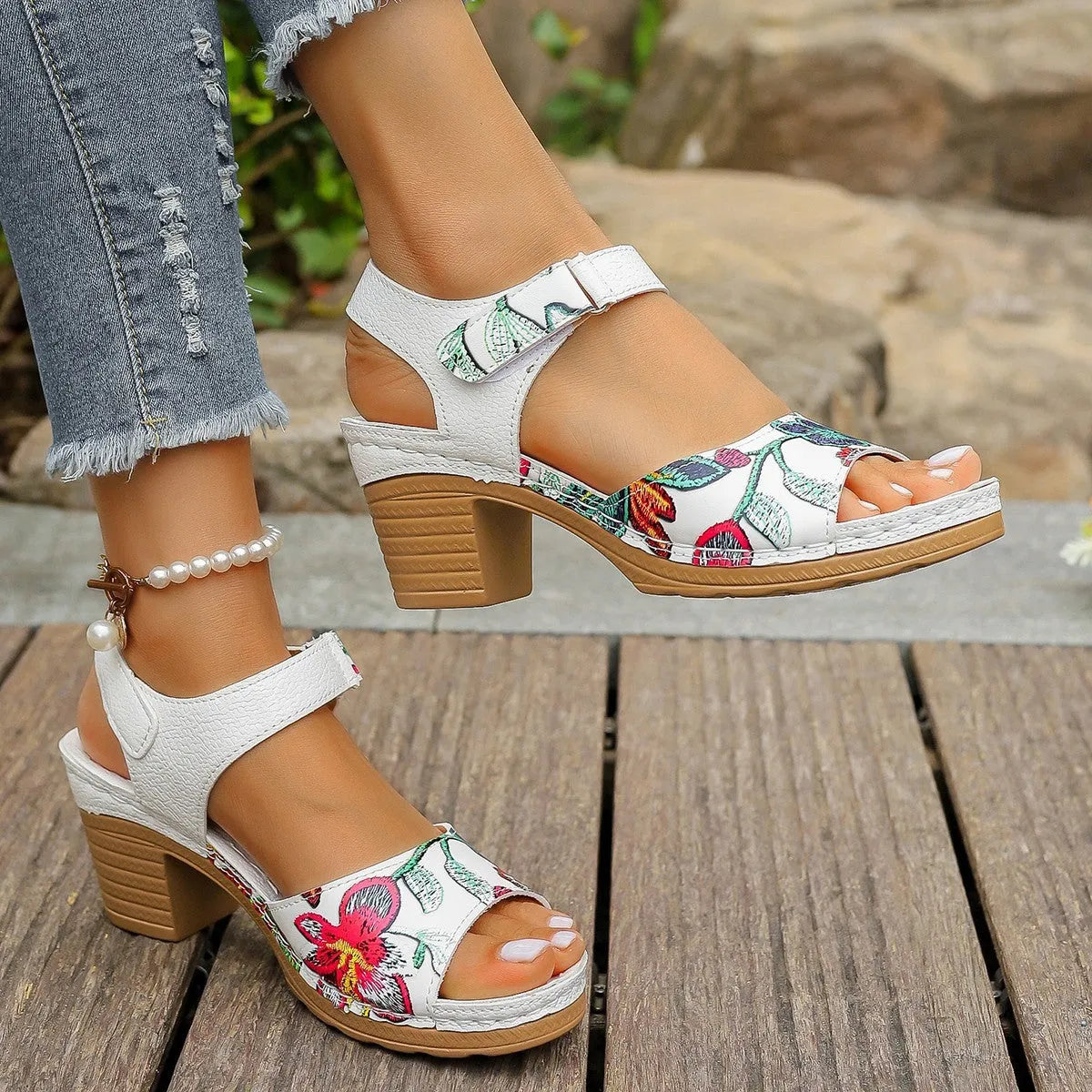 White women's casual high heel sandals with a prominent Velcro strap buckle closure.