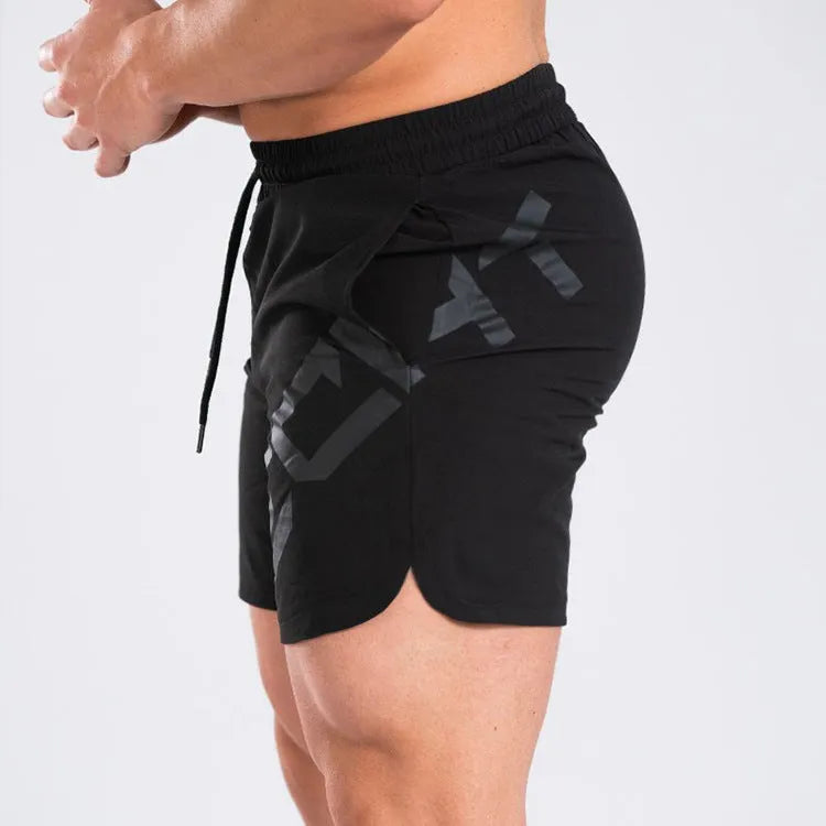 Men's black knee-length running shorts with elastic waist, shown flat for detail.