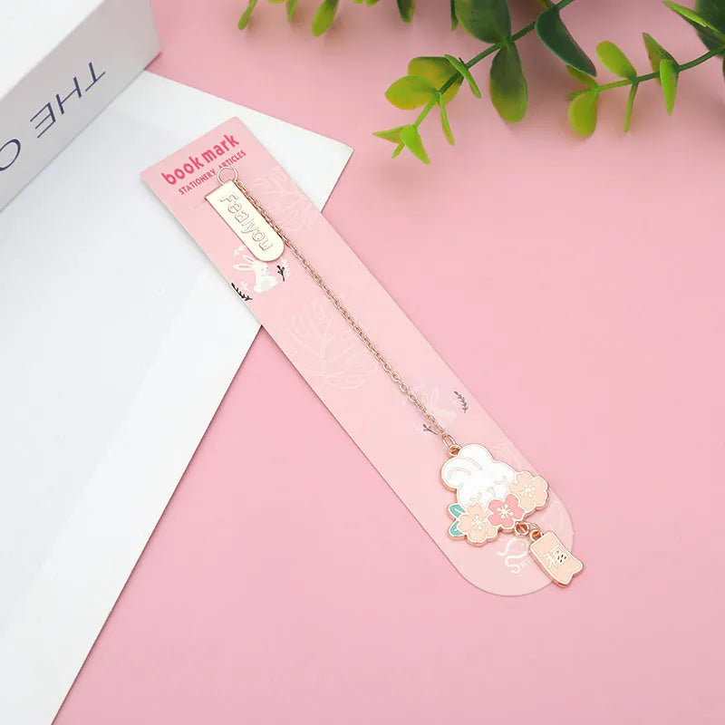 Creative cartoon metal pendant bookmark featuring cherry blossom cat and rabbit designs.