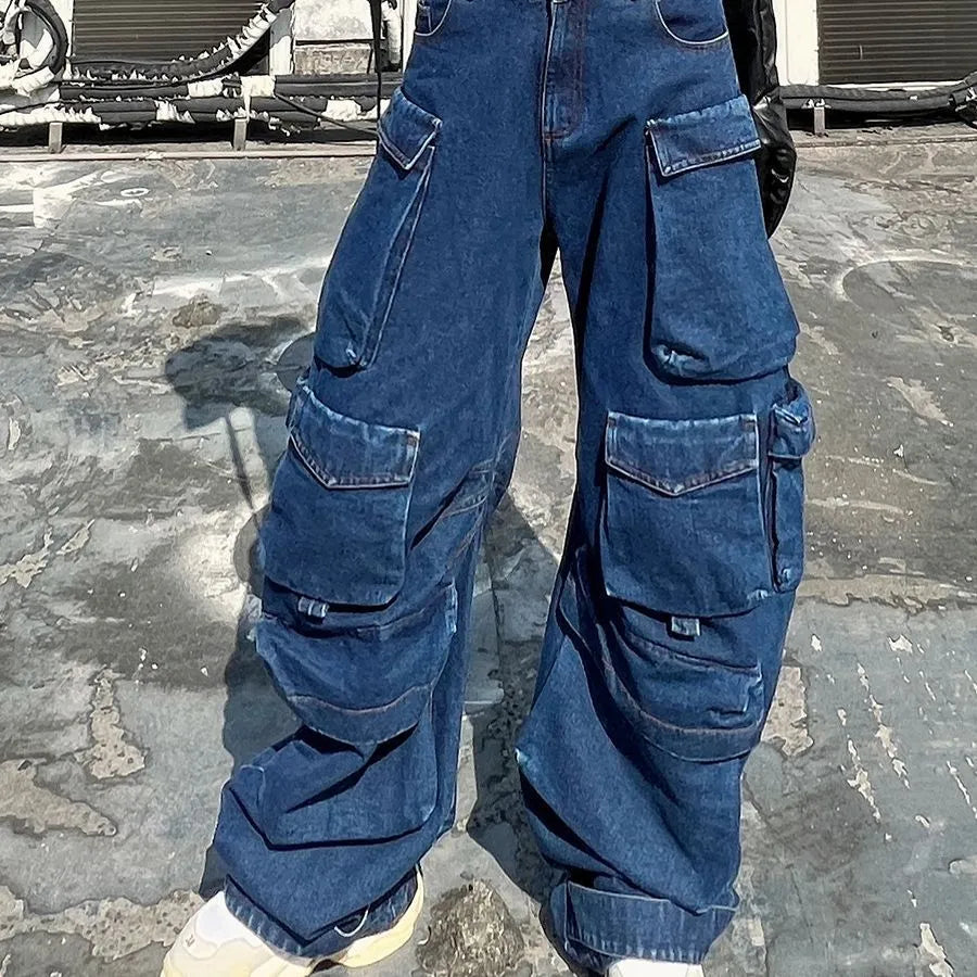 Dark blue wide-leg jeans with distressed detailing, high waist, and multiple pockets on mannequin