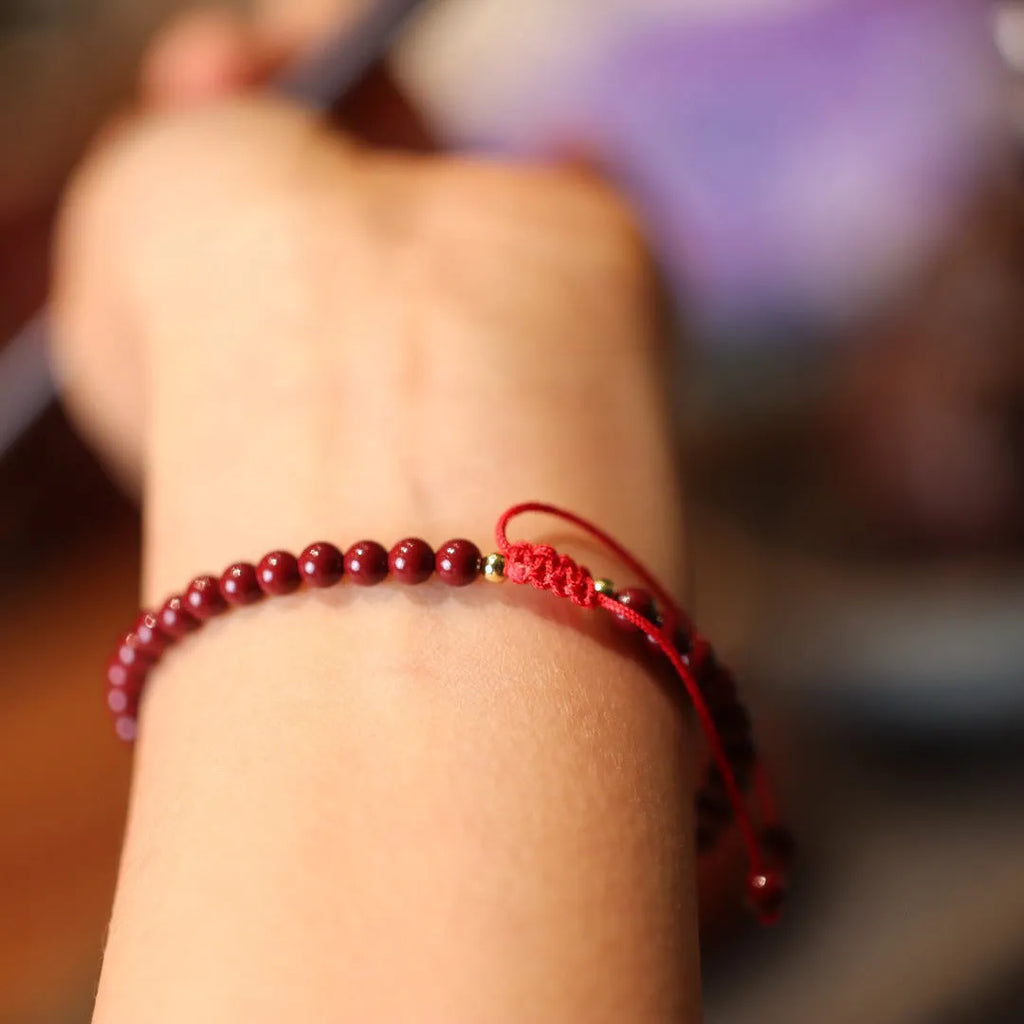Handcrafted purple gold sand design cinnabar bracelet or anklet with geometric Chinese style patterns.