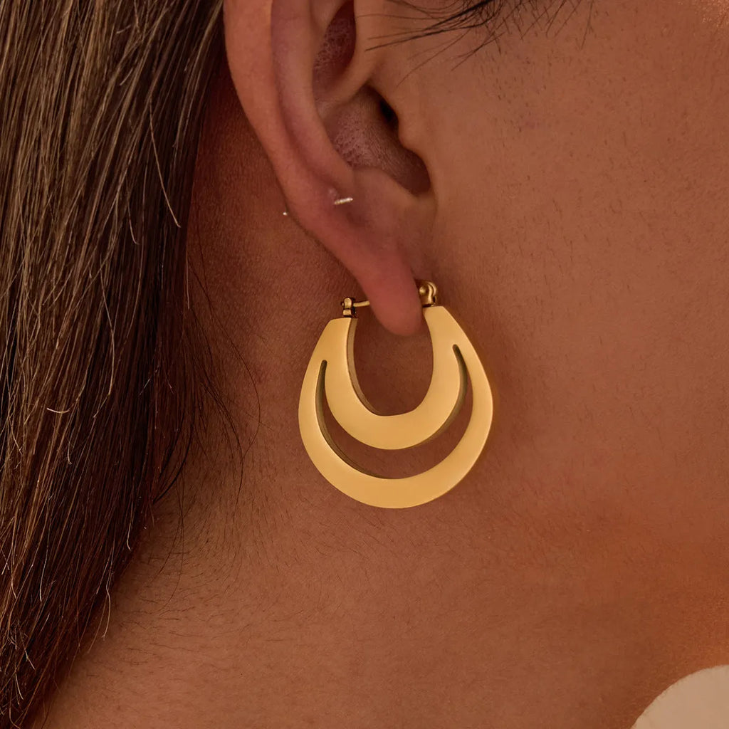 Geometric French hook earrings with round design in gold and steel metallic finishes