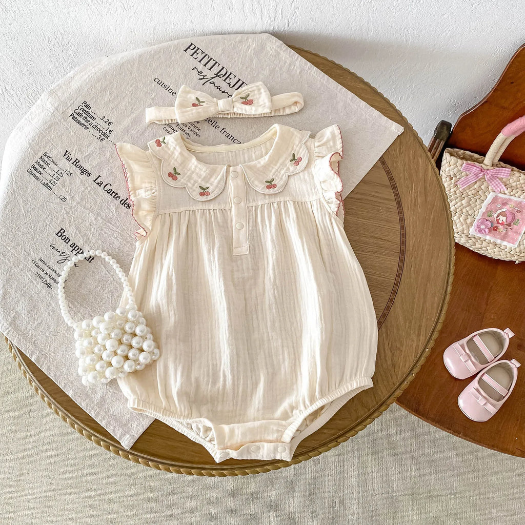 apricot cotton sleeveless double breasted baby jumpsuit with matching hair band