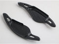 Steering wheel paddle shifter modification kit with carbon fibre pattern on black background