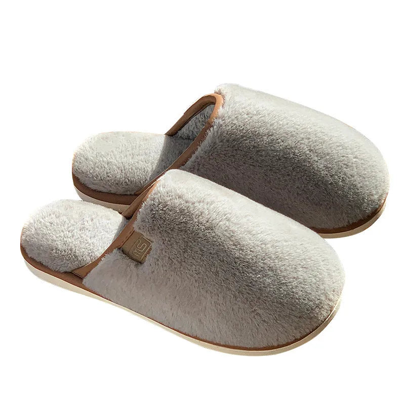 Winter plush slippers in solid colours with non-slip PVC soles and car stitching detail