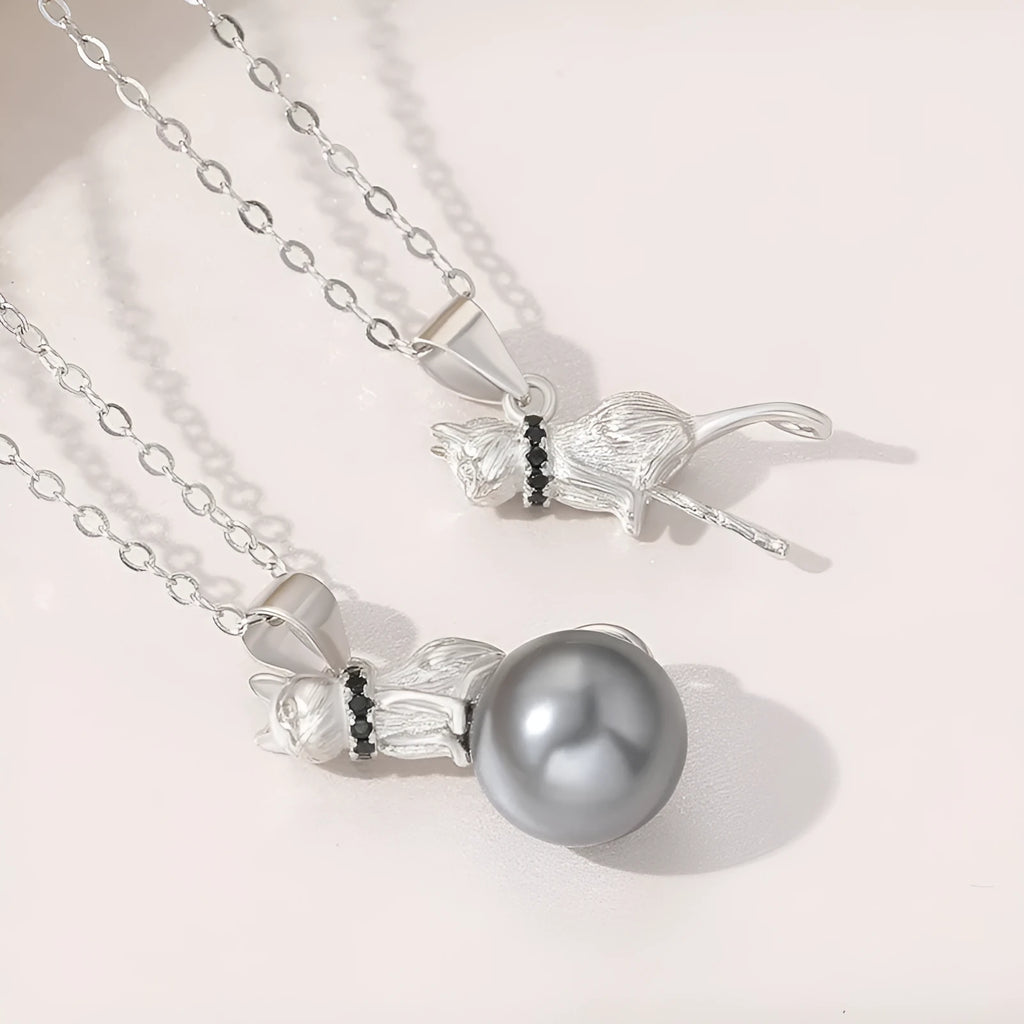 Sterling silver cat pendant necklace on a chain, showing elegant clavicle-length design.
