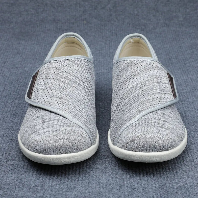 Beige widened fit leisure shoes with Velcro strap and rubber foam sole.