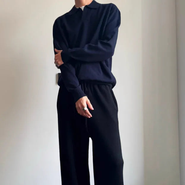 Man's pure wool polo sweater with a lapel collar in a loose fit, shown in navy blue.