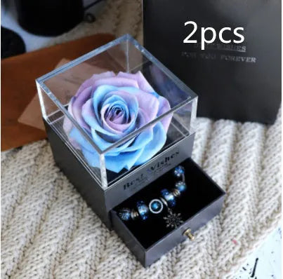 Eternal Flower gift box with preserved roses and carnations inside, measuring 8.5 cm square by 10.5 cm high