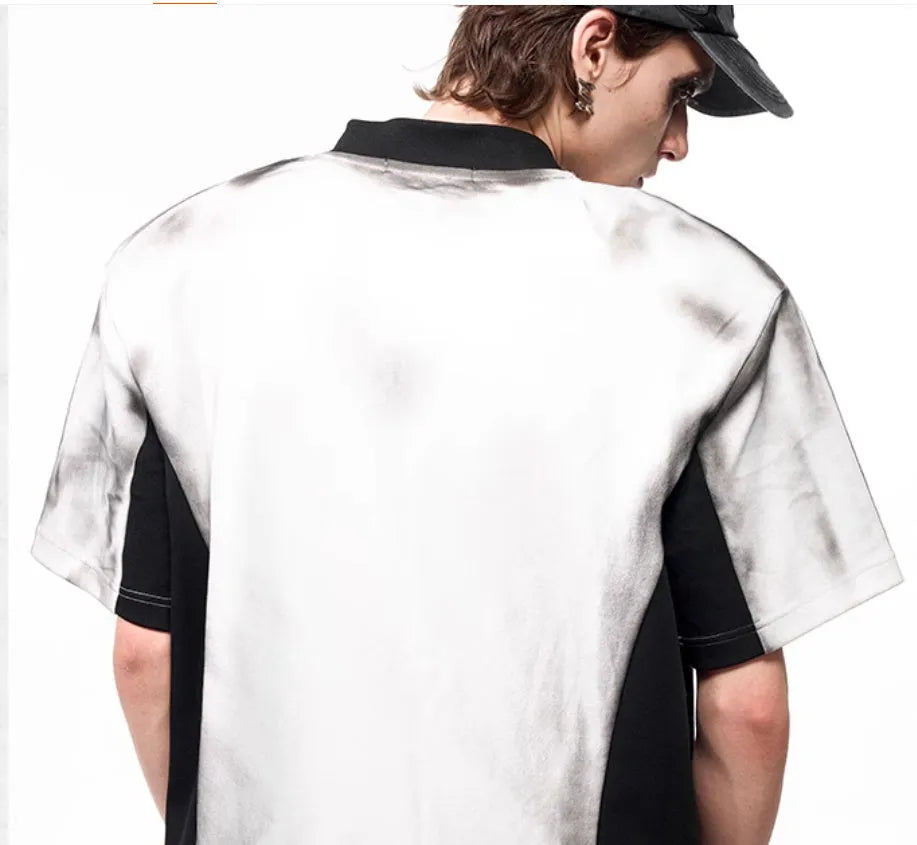 Women's V-neck short sleeve top with a black and white letter snake pattern print and padded shoulders.