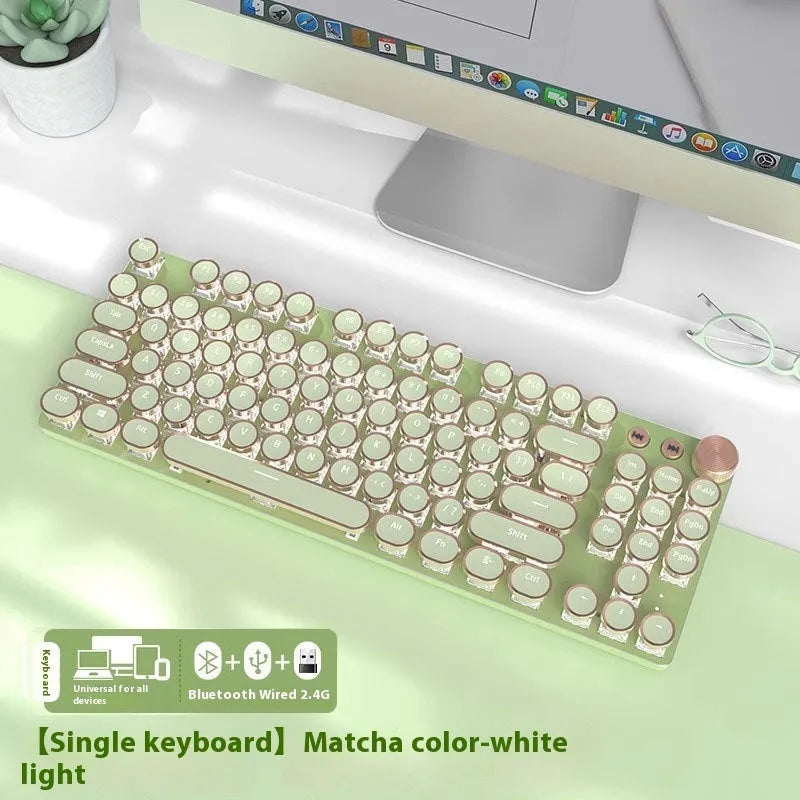 Matcha green mechanical gaming keyboard with white backlighting, aluminium panel, and multifunction knob on desk