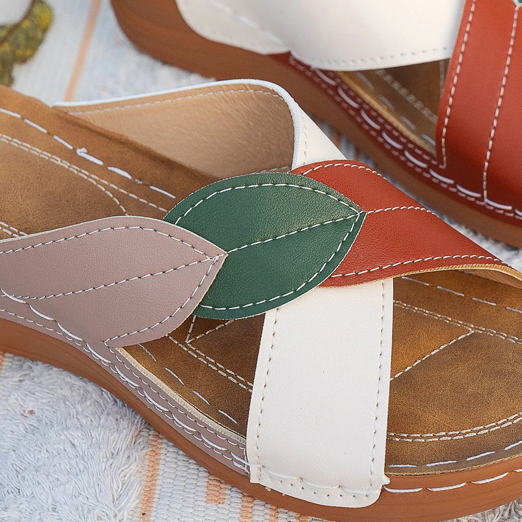 Women's red-brown cork wedge sandals with leaf design and gladiator lace-up ankle strap