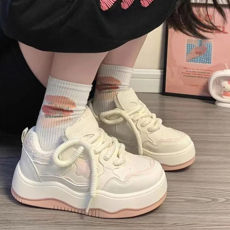 Women's green and pink patent leather platform sneakers with round toe and lace-up closure