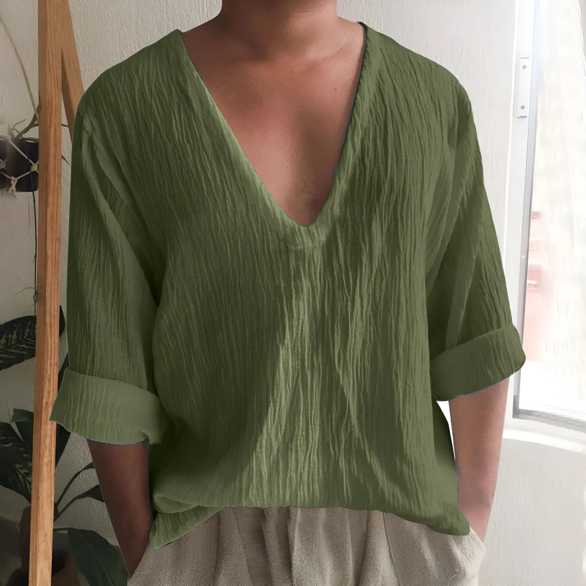 Men's long sleeve V-neck t-shirt in washed cotton fabric, shown in solid colour options.