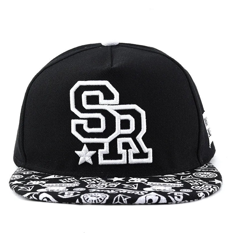 Cotton baseball cap with embroidered letters on the front, shown in black and white colours.