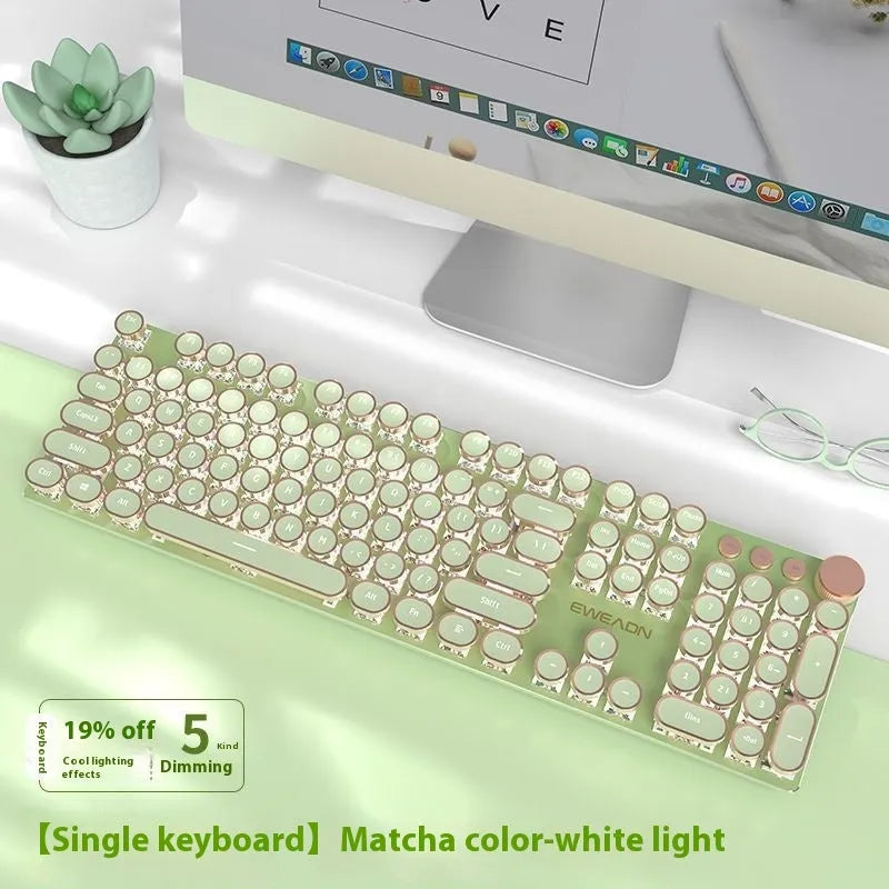 Matcha green mechanical gaming keyboard with white backlighting, aluminium panel, and multifunction knob on desk
