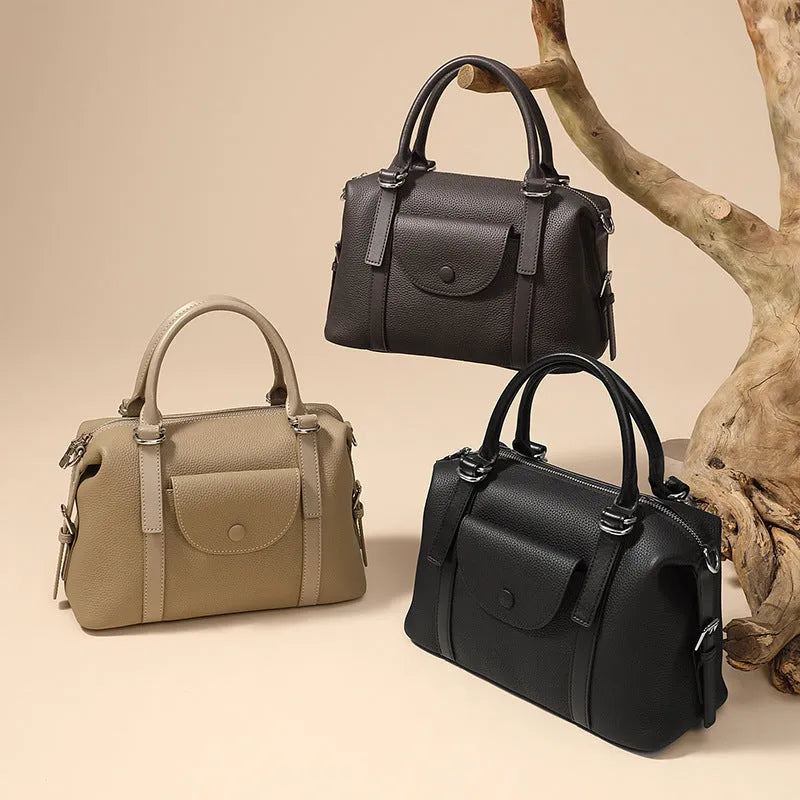Genuine leather ladies handbag with contrast stitching and metal lock detail