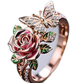 Adjustable butterfly ring with colourful oil-drip effect showing floral and insect details