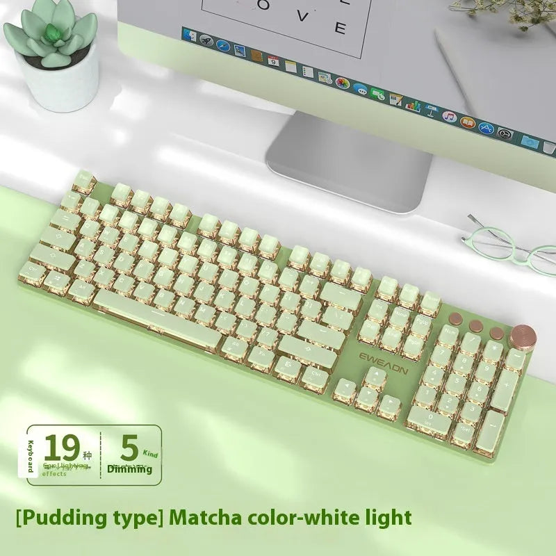 Matcha green mechanical gaming keyboard with white backlighting, aluminium panel, and multifunction knob on desk
