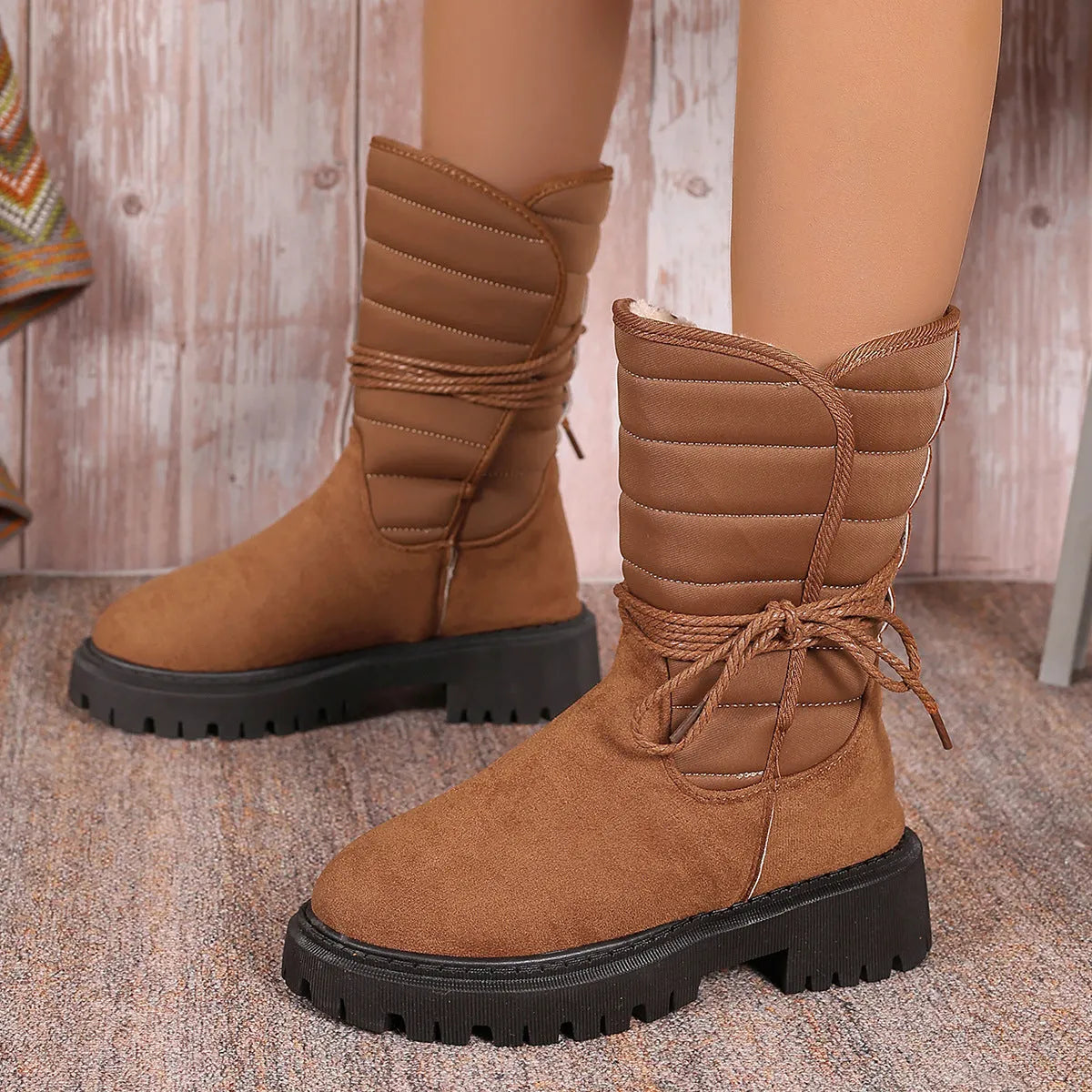 Women's black chunky heel snow boots with lace-up design and fleece lining