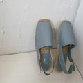Women's retro-style flat sandals in canvas with an animal pattern, shown in multiple colours.