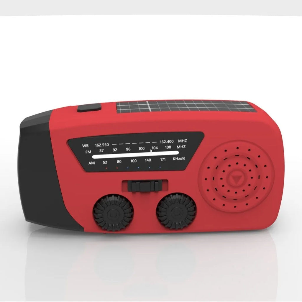Red rechargeable hand crank emergency radio with LED torch and USB charging port.
