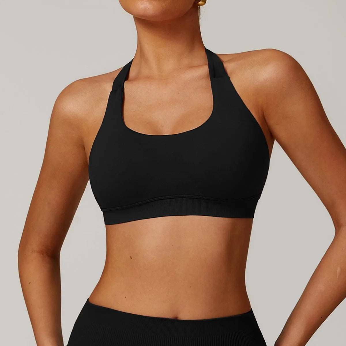 Women's halter neck yoga sports bra with removable pads in various colours.