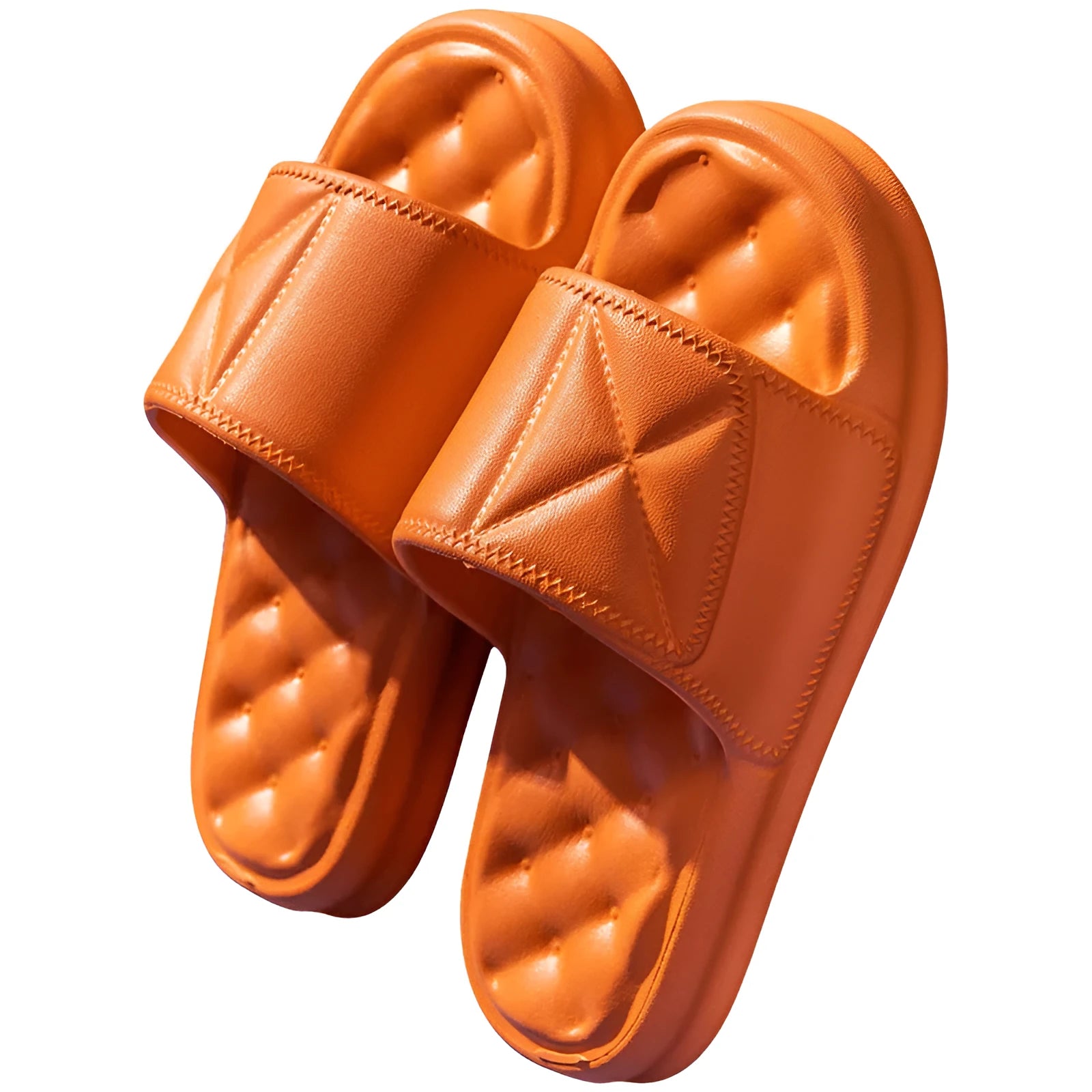 Pair of thick-soled EVA bathroom slippers in various colours, showing non-slip sole texture.