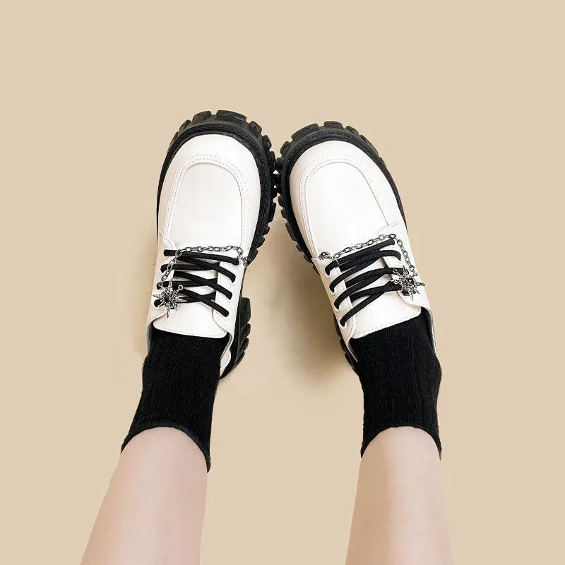 Women's Duke Asterism loafers with a metal cross strap and round toe in preppy style