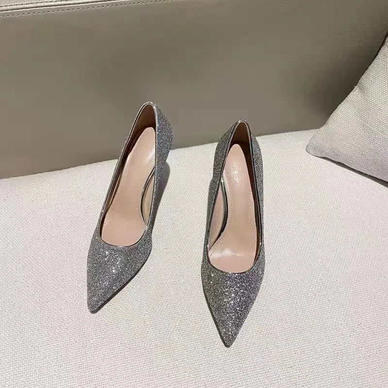 Women's silver crystal stiletto wedding shoe with a 9cm heel on a white background.