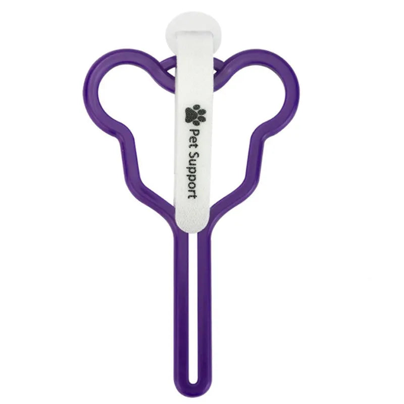 Hands-free dog poop bag holder with black velcro strap and clip attached to a dog leash.