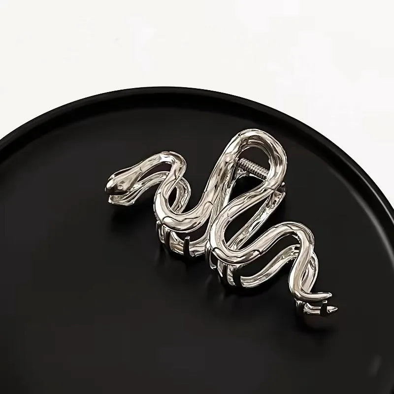 Silver metal hair clip with Slytherin serpentine snake design measuring 10.5 cm