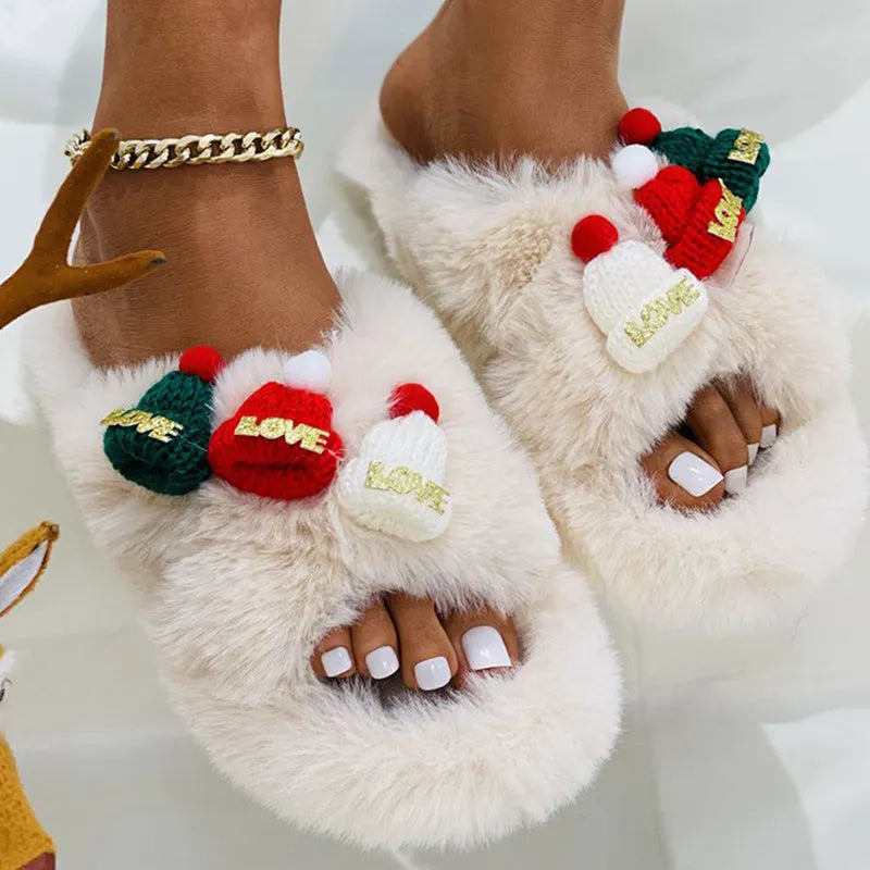 Women's Christmas hat design faux plush slippers with hairy texture and rubber sole.
