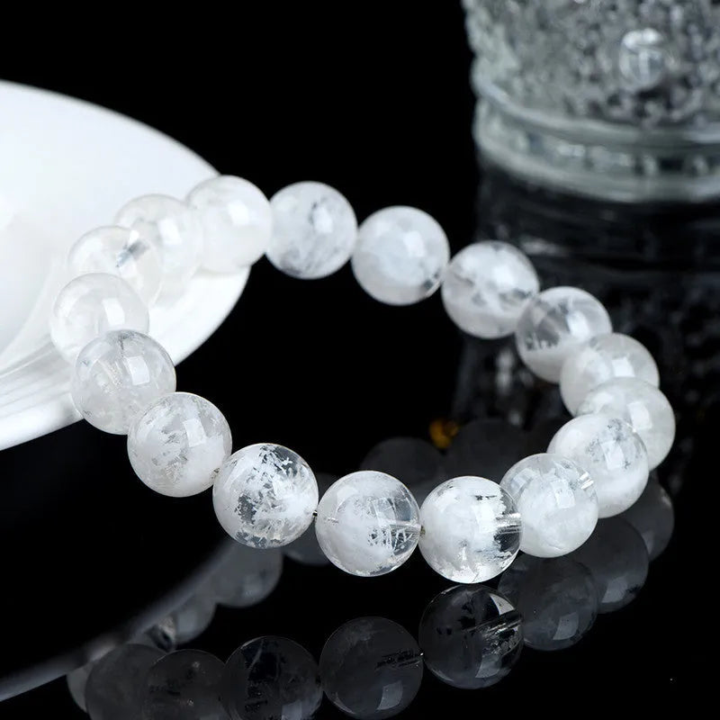 Women's crystal bracelet with round blizzard snowflake beads and geometric Ruyi Xiangyun design.