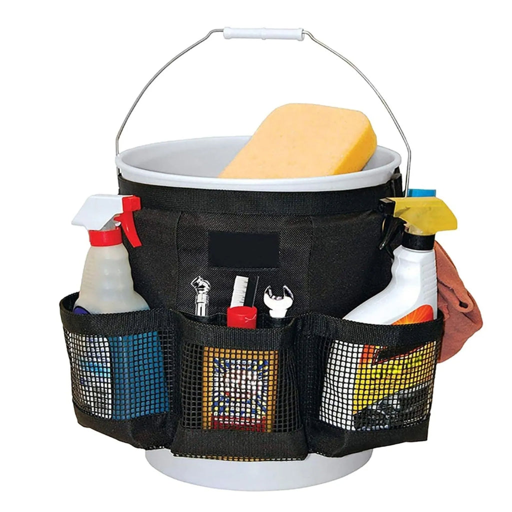 Black cylindrical polyester storage bag hanging on a 5-gallon barrel for outdoor tool organisation.