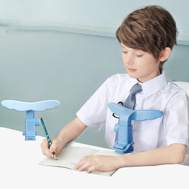 Student anti-myopia posture corrector orthosis with silicone and ABS frame, available in blue and pink, for desk or card table use