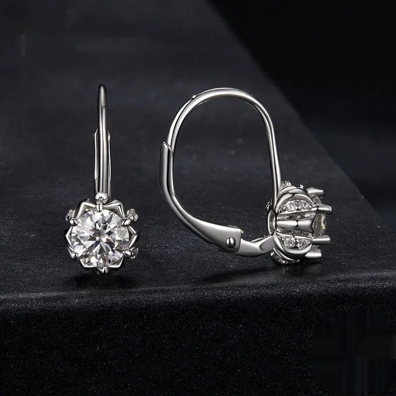 Sterling silver flower bud ear clips with white gold plating and 0.5ct moissanite stone