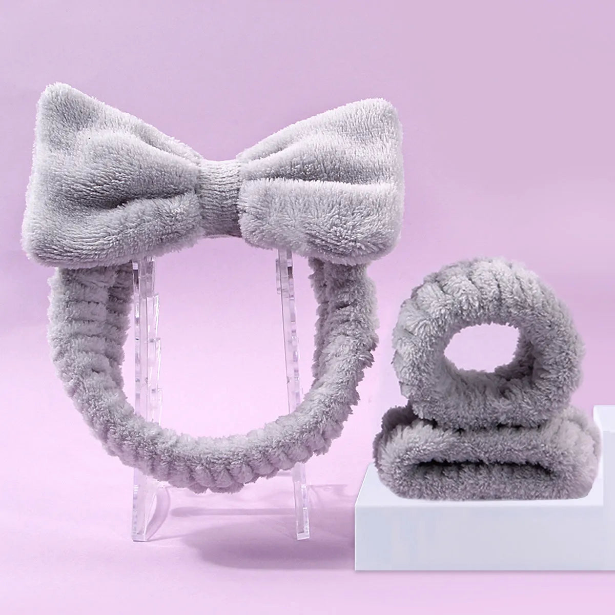 Facial brush and coral fleece hair band set in purple colour with plastic handle and nylon bristles
