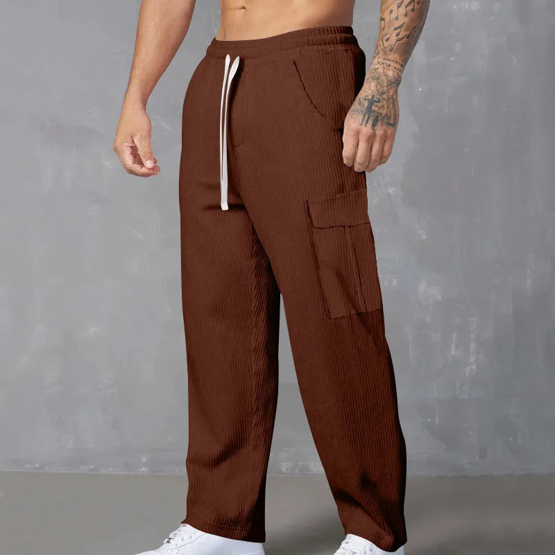 Men's loose-fitting corduroy cargo trousers in navy blue with straight wide-leg cut and elasticated waist