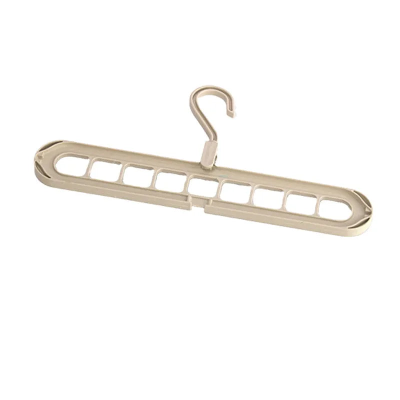 Green plastic nine-hole hanger folded flat showing multiple trouser hanging points