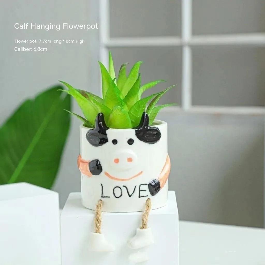 Ceramic hanging foot flowerpot in a cartoon style for desktop succulents.