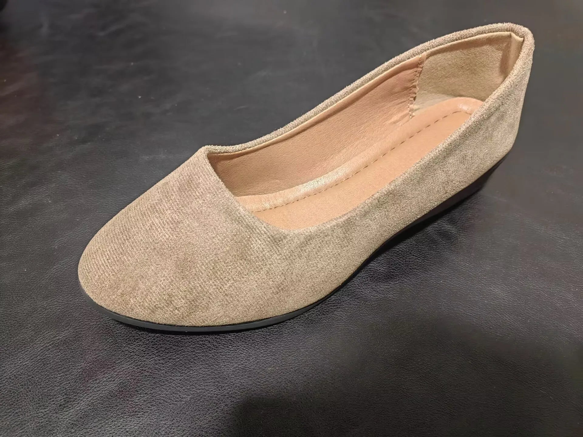 Women's plus size low wedge pumps in Gommino style with pointed toe and suede upper.