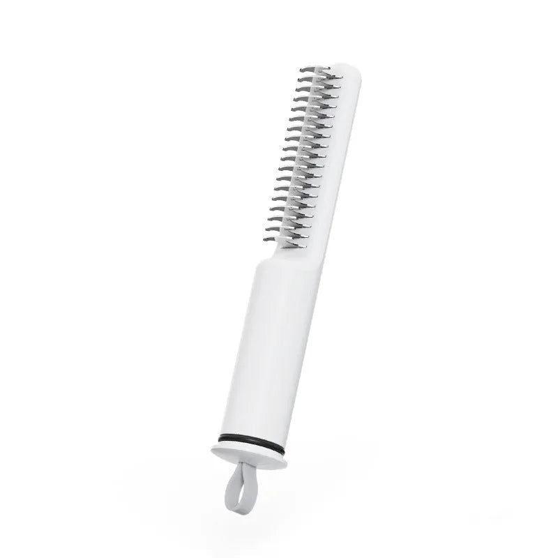 Stainless steel dog dematting comb with ergonomic handle on a white background