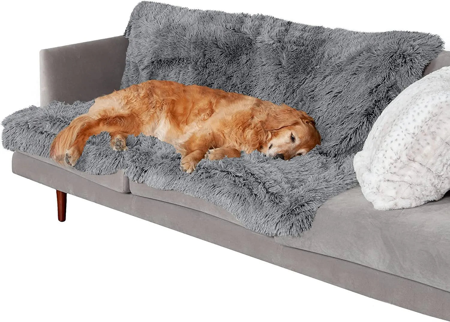 Plush waterproof dog cushion in dark grey, shown in a large size on a wooden floor.