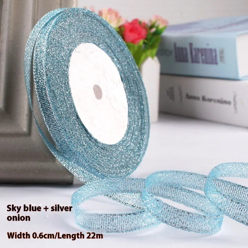 Roll of 0.6cm wide coloured polyester gift ribbon with 22 metre length.