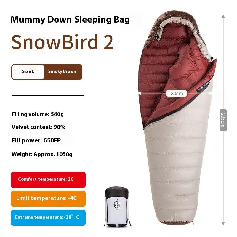 Goose down mummy style sleeping bag for adults with a storage bag.