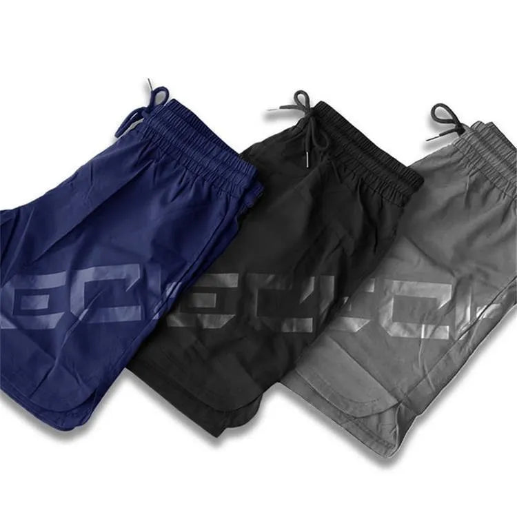 Men's black knee-length running shorts with elastic waist, shown flat for detail.