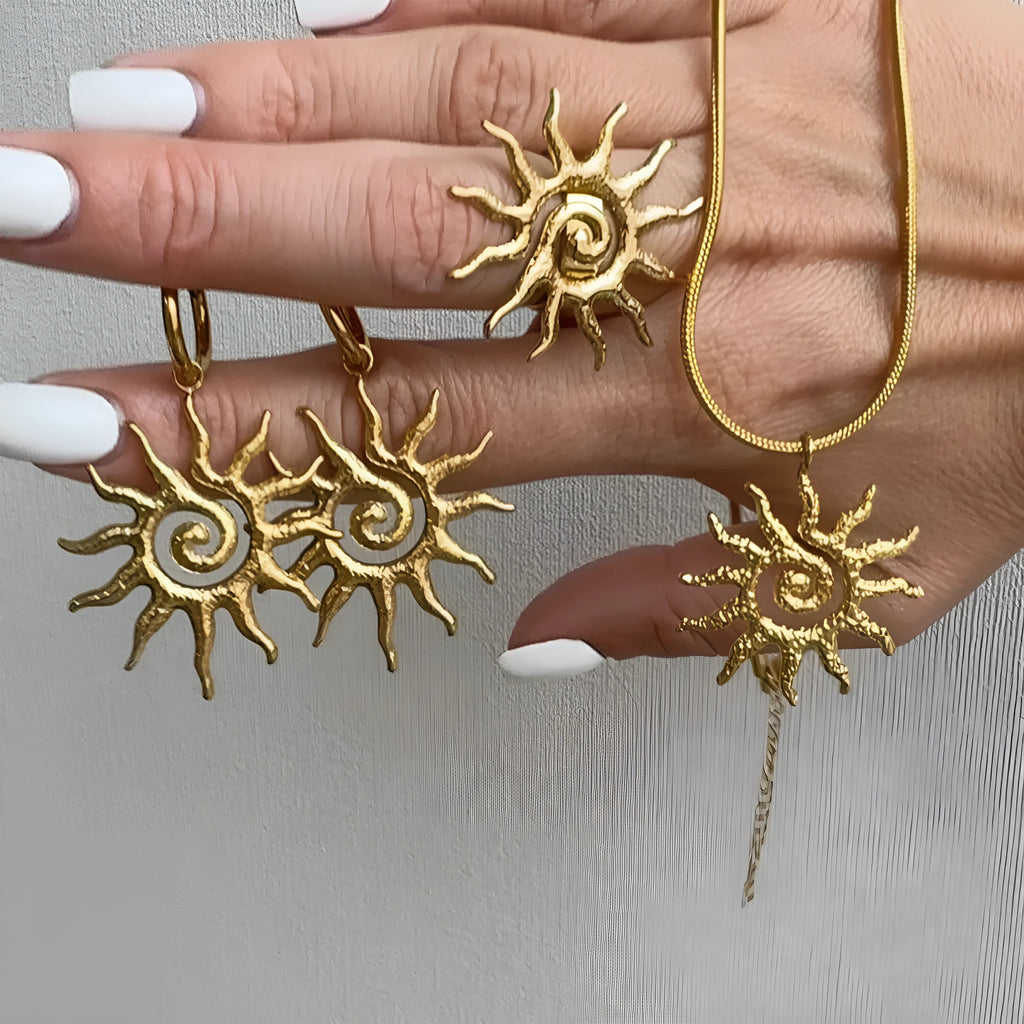 Gold sun hollow pendant necklace on regular chain with matching earrings and ring in zinc alloy electroplated finish