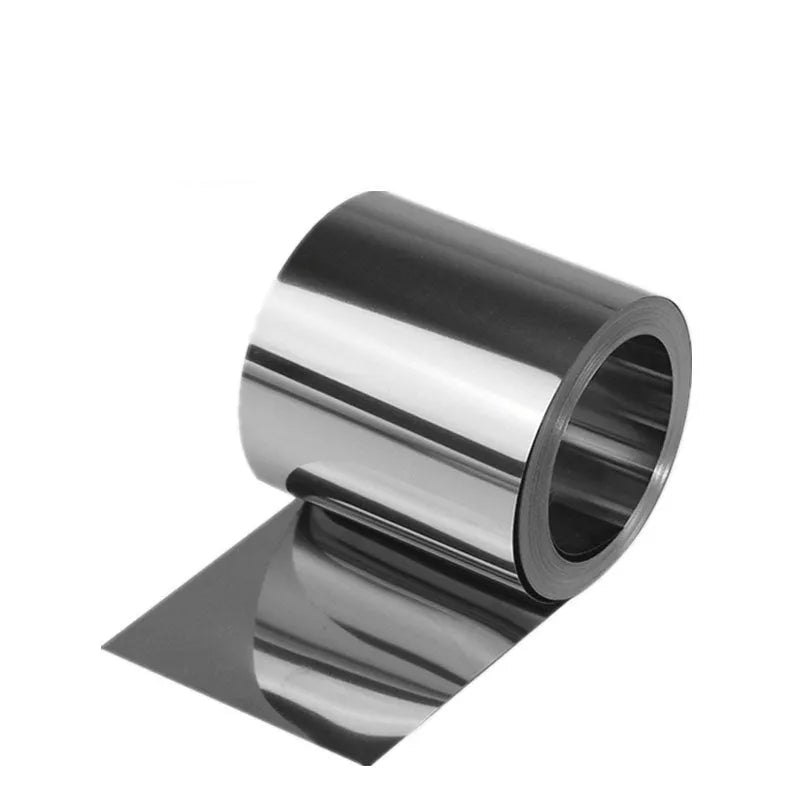 304 stainless steel metal shim strip on a workshop bench with a ruler showing its thin gauge.